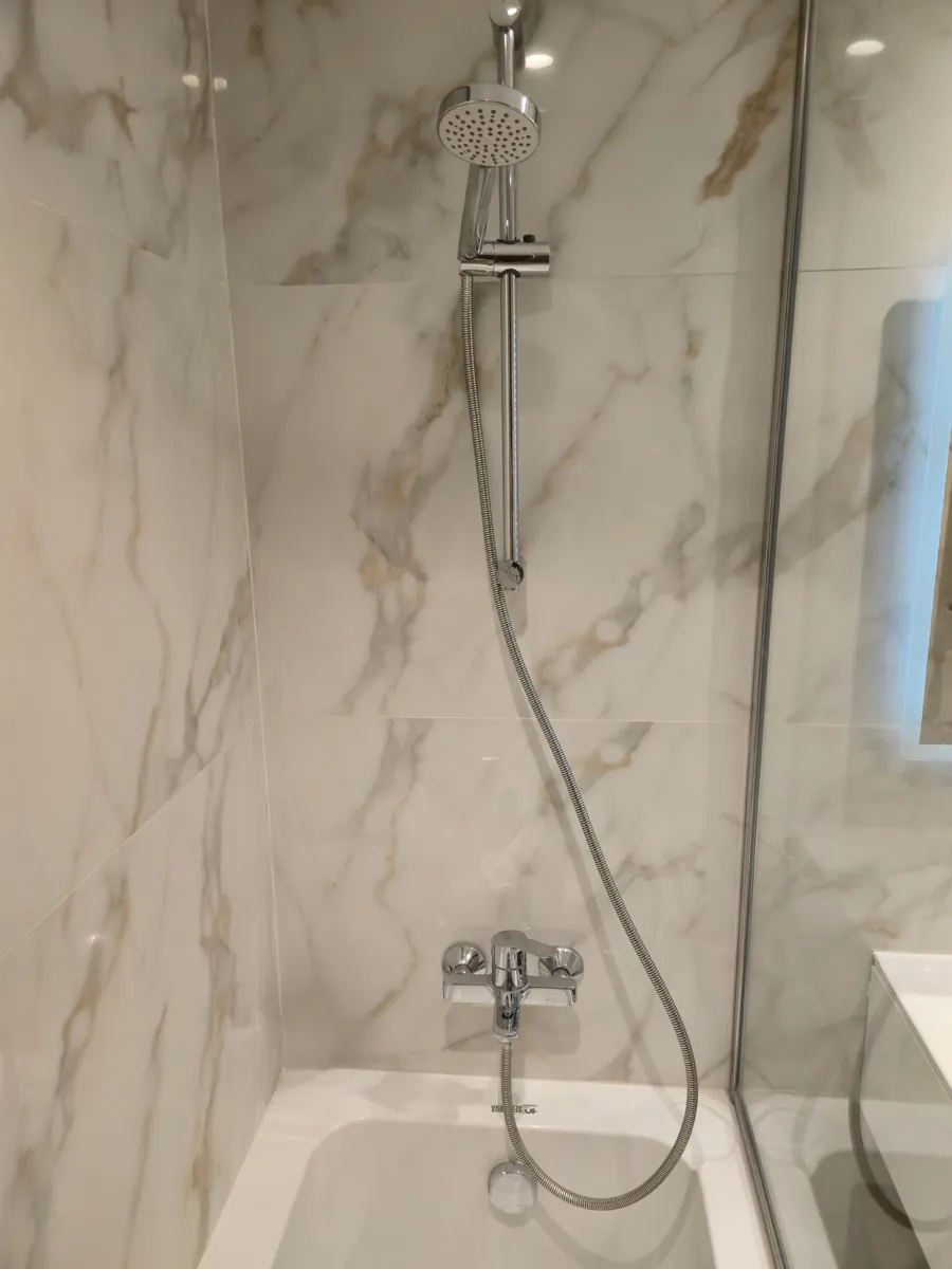 Rain shower head detail on marble