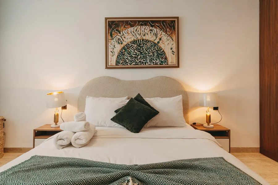 Bedroom with king bed and Tunisian artwork