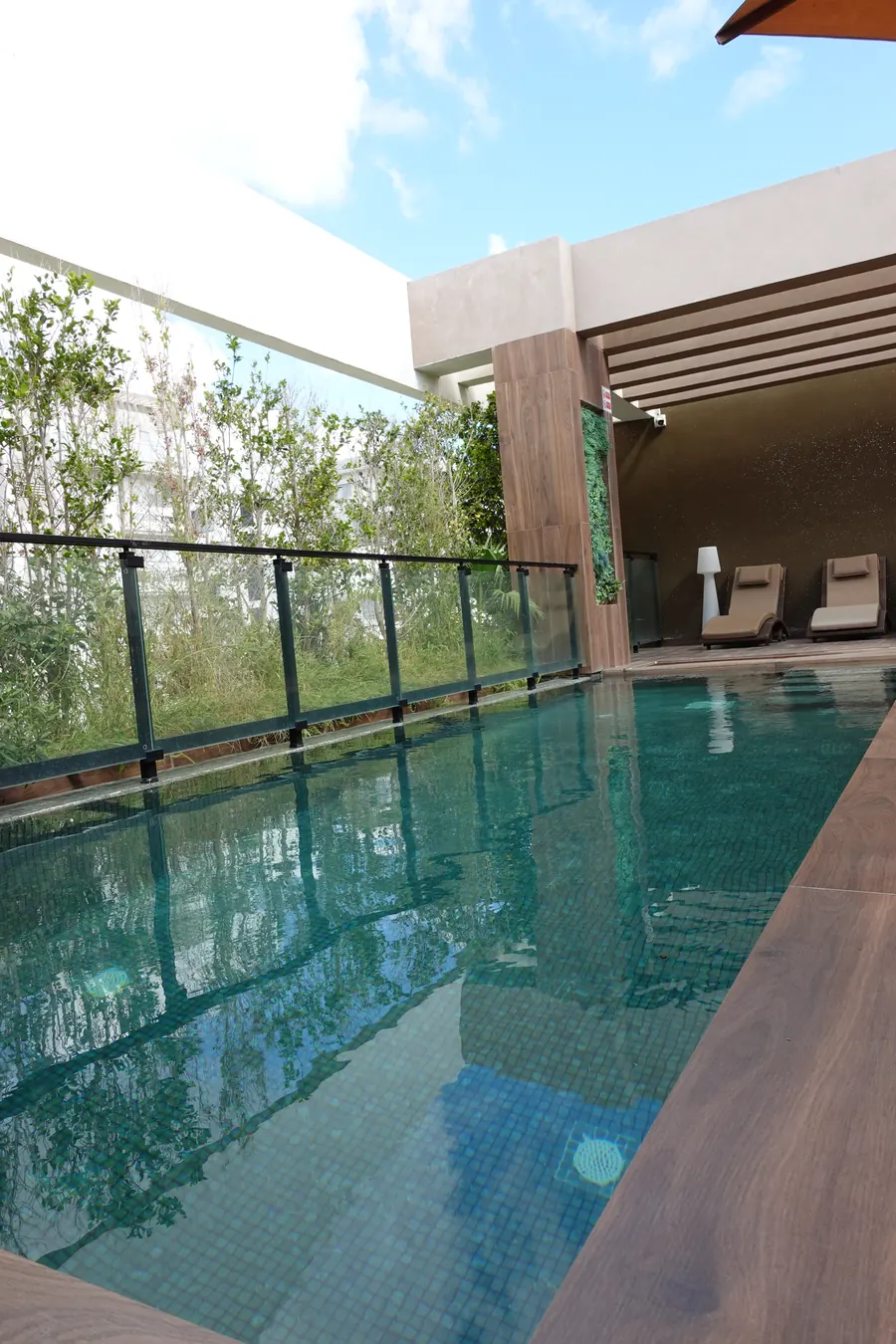 Rooftop pool seen along its glass railing