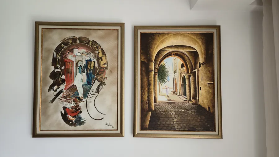 Two Tunisian paintings: a portrait and a medina archway
