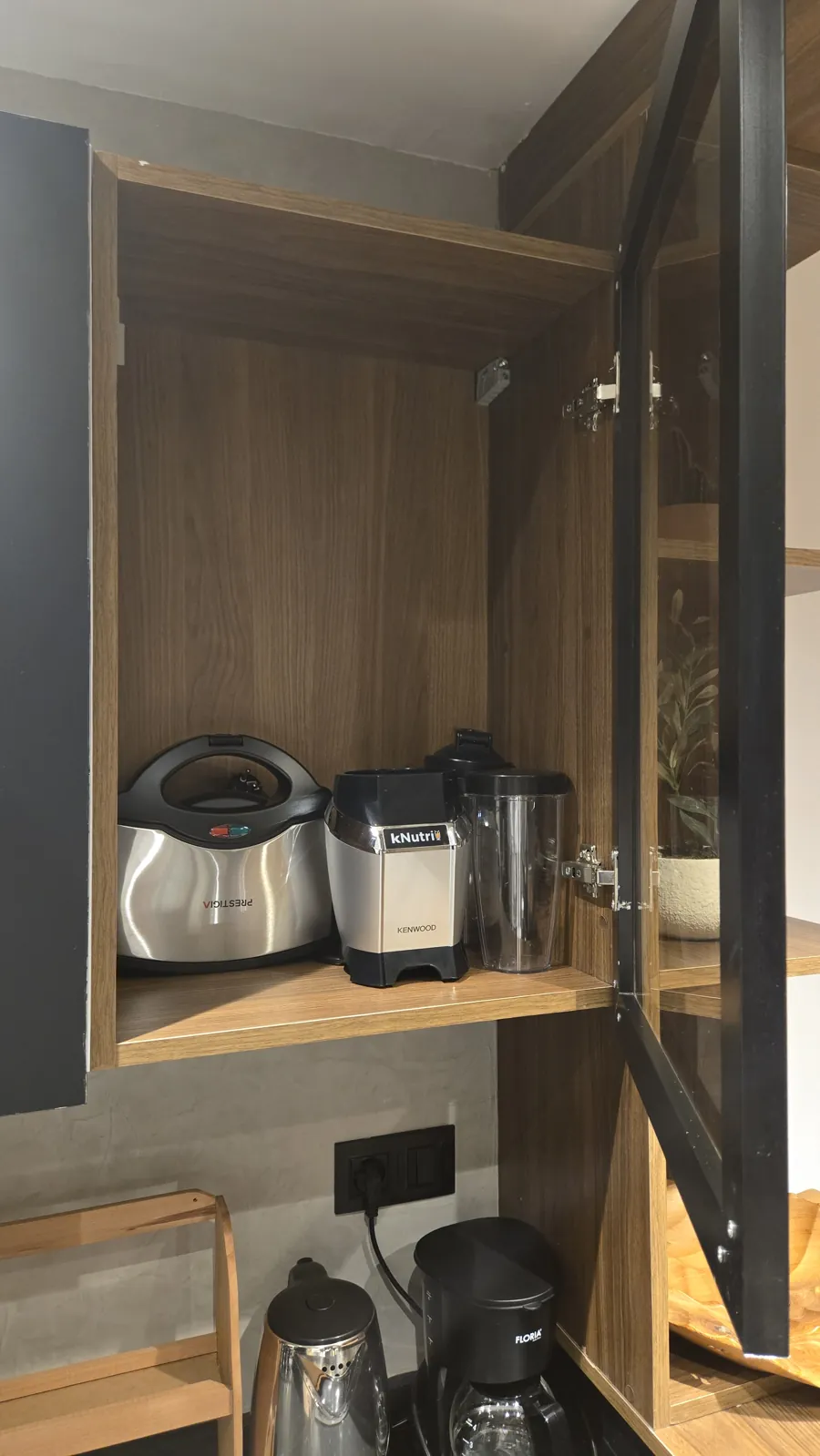 Kitchen cabinet with blender, sandwich press and small appliances